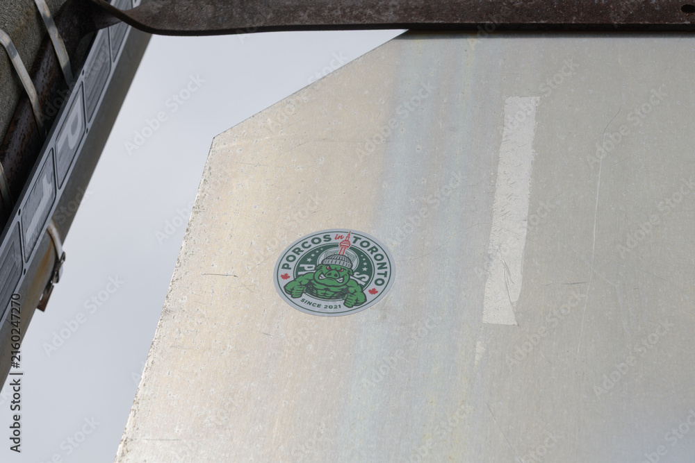 Fototapeta premium PORCOS Toronto slap on the back of a metal sign in the city (supporters' group for Palmeiras, the São Paulo football club)