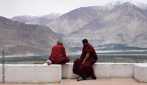 Buddhist monks at Diskit monastery with Nubra valley view in Ladakh, India