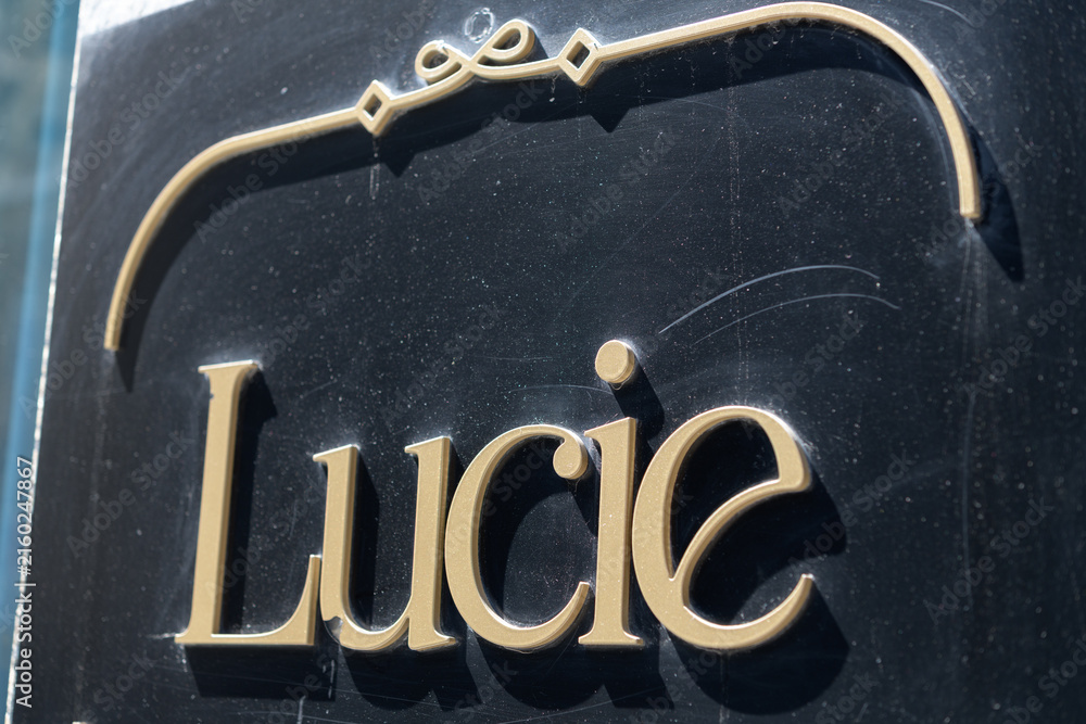 Fototapeta premium sign outside Lucie, a restaurant, located at 100 Yonge St, Toronto