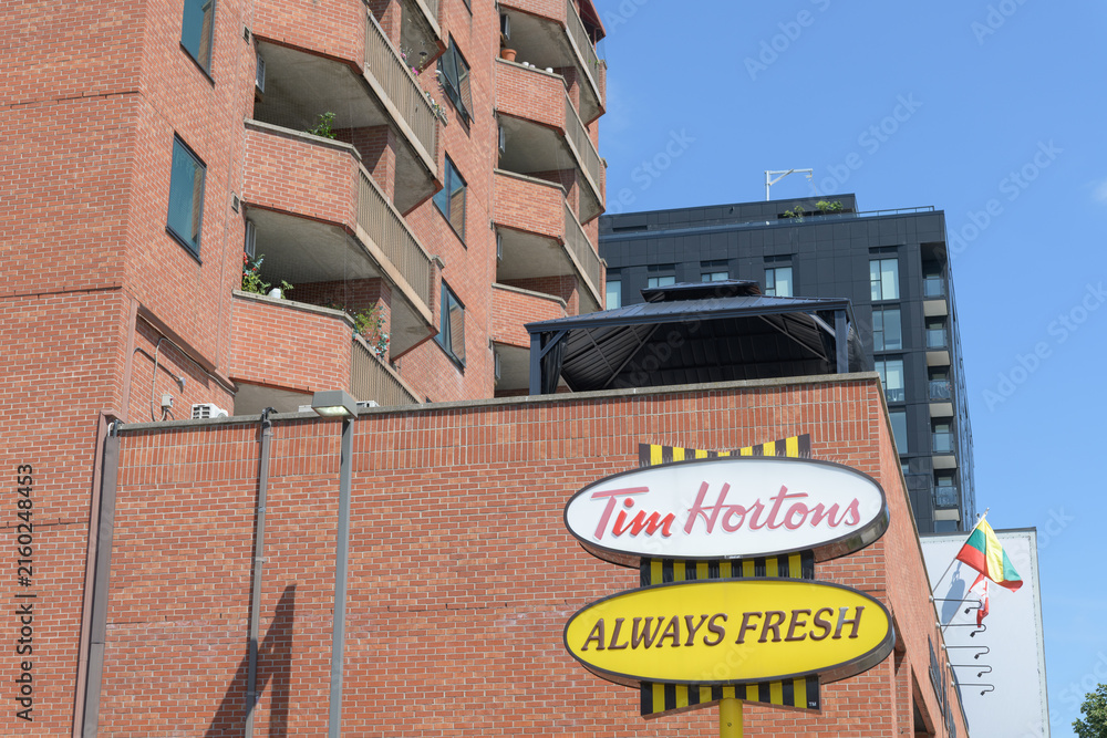Fototapeta premium retro sign in parking lot at Tim Hortons, a coffee shop chain, located here at 1728 Bloor St W at Indian Grove, Toronto