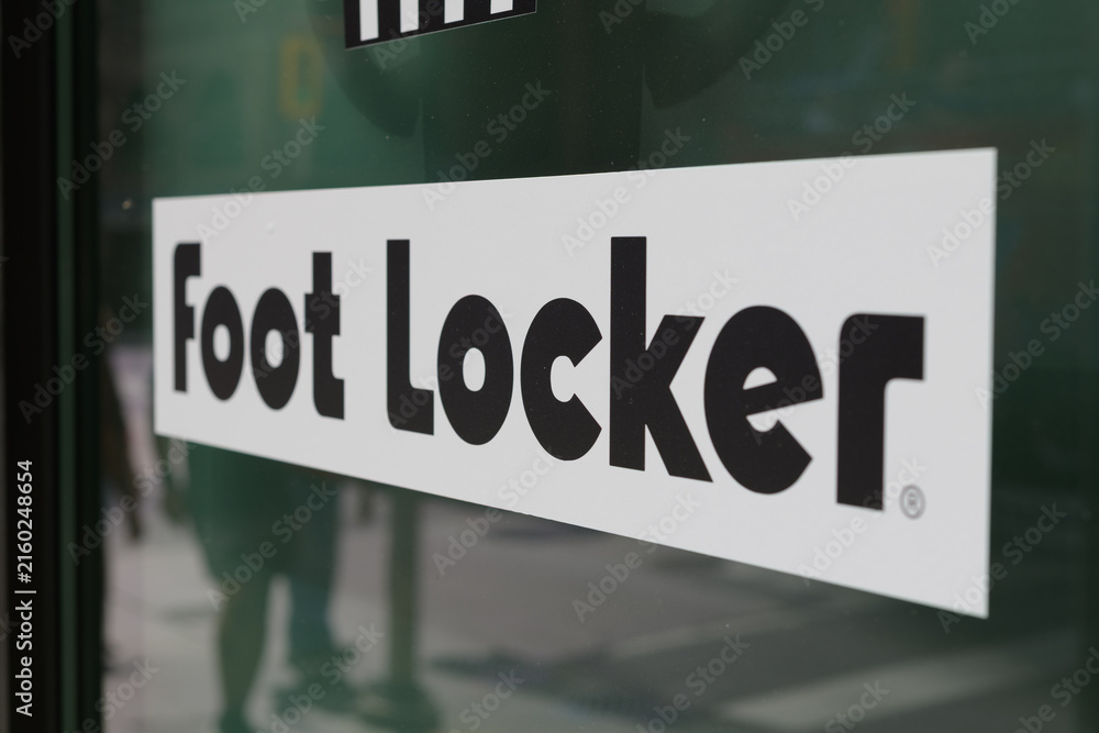 Fototapeta premium close-up of Foot Locker, a major global retail chain that specializes in athletic footwear, sportswear, and casual street fashion, located here at 2 Queen Street West, a special event space, Toronto