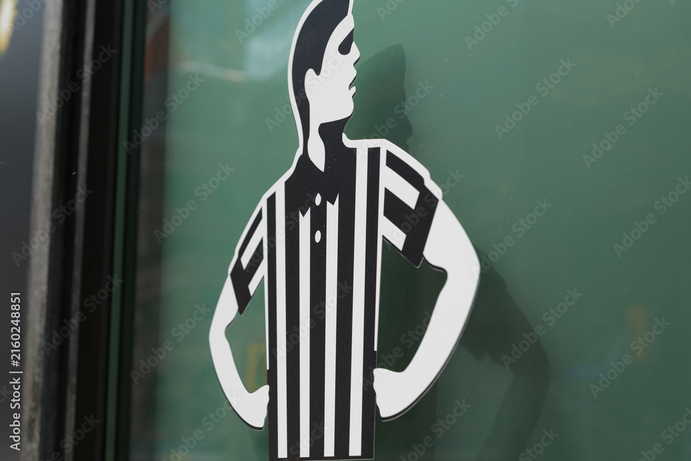 Fototapeta premium close-up of Foot Locker ref logo, a major global retail chain that specializes in athletic footwear, sportswear, and casual street fashion, located here at 2 Queen St W, a special event space, Toronto