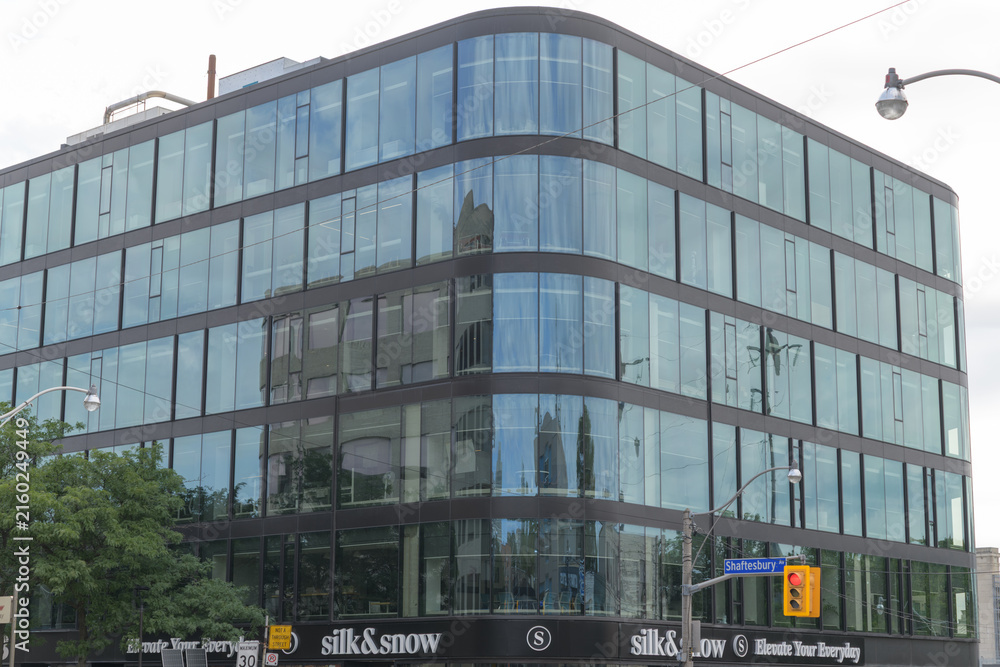 Fototapeta premium new commercial building and sign of Silk & Snow, a mattress store, located at 1133 Yonge St, Toronto