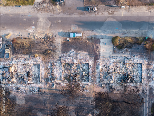 Aerial view of wildfire devastation in Spokane Washington with burned homes and destroyed vehicles