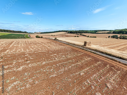 Картината върху платно An aerial drone shot of fields on the Cotswolds during the August 2026 drought near Snowshill, Gloucestershire, England UK