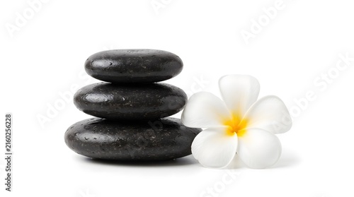 Basalt stones stacked with white frangipani flower on a white background