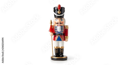 Wooden nutcracker figurine stands against a white background