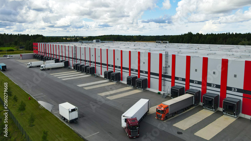 Фотография Large modern logistics center operating with numerous semi trailer trucks at loa