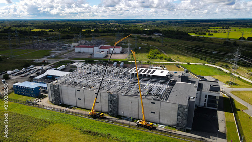 Konstfotografi Large data center facility under construction with cranes and heavy equipment, i