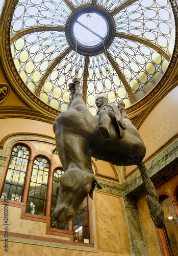 PRAGUE, CZECH REPUBLIC - AUGUST 2011: Famous provocative sculpture of King Wenceslas riding an upside-down dead horse by artist David Cerny inside the Lucerna Palace passage.