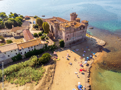 Quadro su tela Aerial view of Santa Severa Castle near Civitavecchia Rome, situated by the sea with clear water in Ladispoli