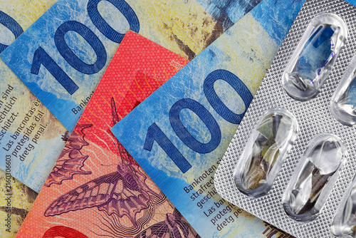 You can see Swiss banknotes under the empty blister that contained the capsules