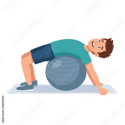 Young man stretching back on exercise ball for fitness and relaxation  