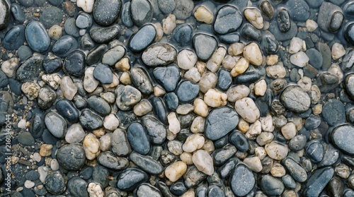 Macro Top View of Smooth River Stones in Grey and Slate Blue Tones