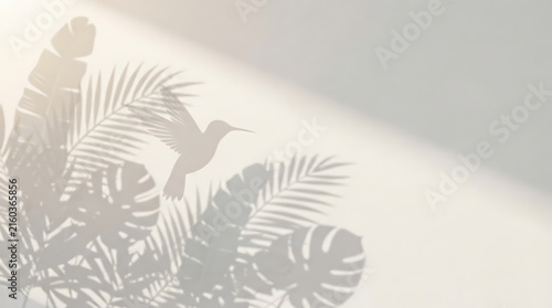 Graceful Hummingbird and Tropical Leaf Shadows on a Clean White Wall