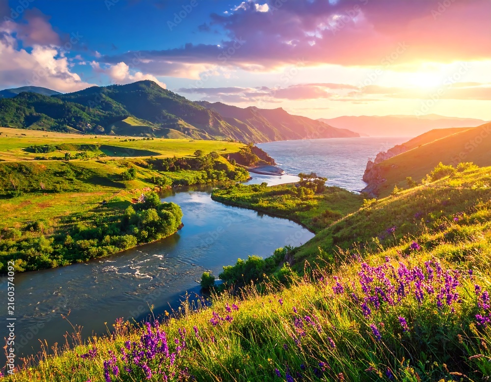 Naklejka premium Serene lake surrounded by rolling green hills at sunrise.
