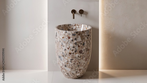 Modern bathroom design featuring a unique terrazzo sink with a minimalist wall and stylish faucet fixtures in a contemporary interior setting