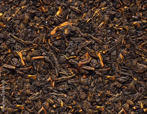 Dry loose leaf black tea macro texture background