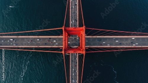Aerial view of the iconic golden gate bridge in san francisco with traffic and surrounding dark blue ocean waters