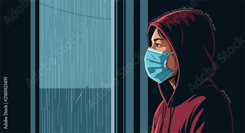 Person wearing a protective face mask and hoodie stands by a window, looking out thoughtfully at the falling rain.