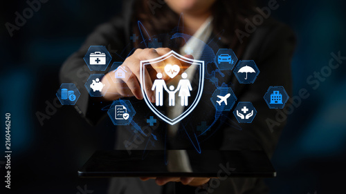 Business professional presenting digital health insurance icons on a tablet device with futuristic background emphasizing protection and care. Entropy.