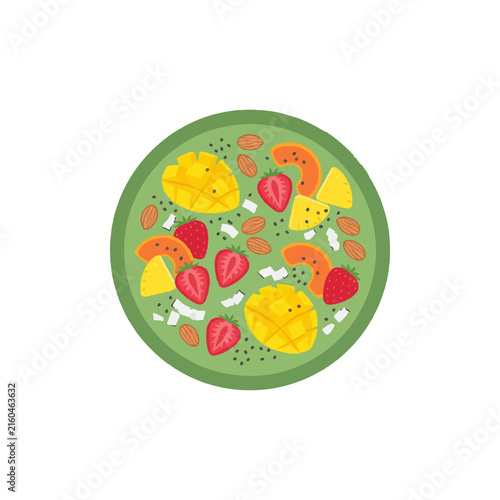 Vibrant fruit salad bowl with mango slices strawberries almonds and coconut bits.