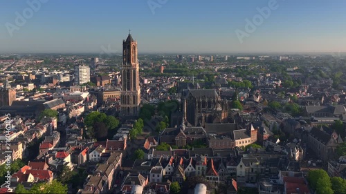 Utrecht City in morning light. Sunrise in the Netherlands. Dom Tower of Utrecht Aerial View, Sunny Dutch City Skyline.