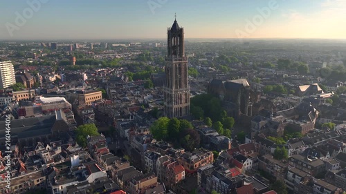 Utrecht City in morning light. Sunrise in the Netherlands. Dom Tower of Utrecht Aerial View, Sunny Dutch City Skyline.