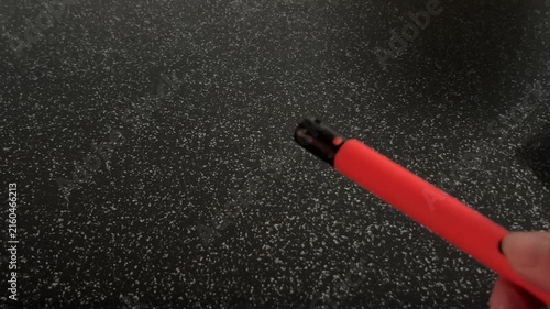 A gas lighter is clicked repeatedly without producing a flame, highlighting ignition attempts and crisp mechanical clicking sounds. High quality FullHD footage