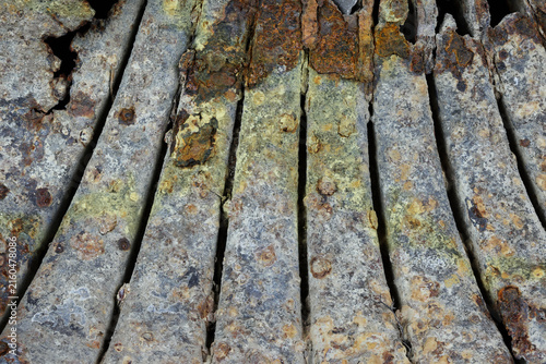 Abstract close-up of heavily rusted metal forming a natural shell shape. Perfect textured background for industrial design, grunge art, and concepts of decay.