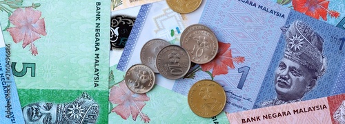 Canvas Print Malaysian ringgit money banknotes and coins on table