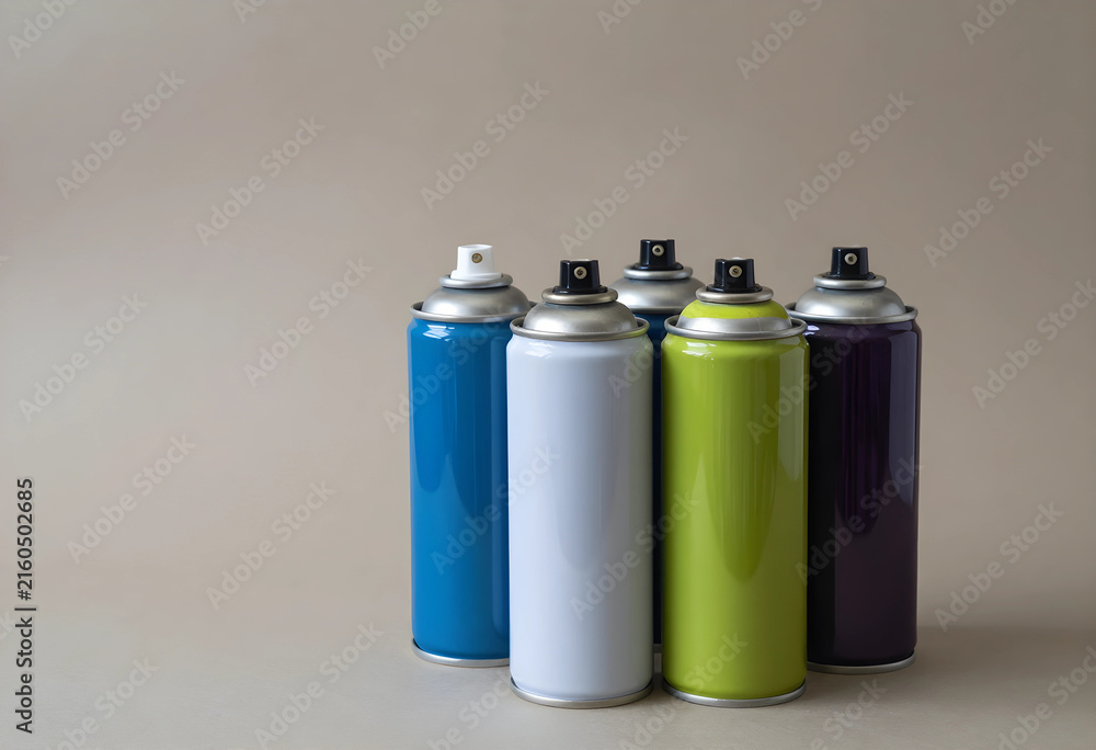 Fototapeta premium Art and craft supplies, colorful spray paint cans for graffiti and creative projects, DIY home improvement tools