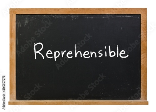 Fotografie Reprehensible written in white chalk on a black chalkboard isolated in a wooden