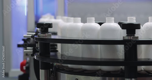Plastic bottles production technology demonstrates efficiency and productivity at factory. Empty containers for liquid substance packaging store at plant