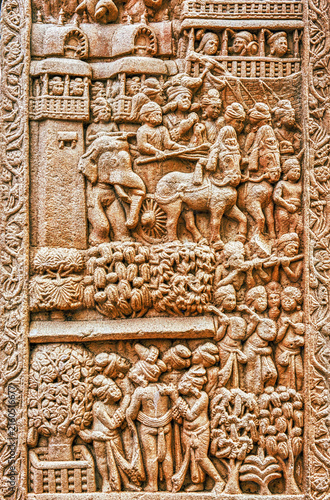 Buddhist narrative relief depicting a royal procession entering a fortified city, with horse-drawn chariots, palace balconies, spectators, and attendants, from the Great Stupa Torana at Sanchi, Sanchi