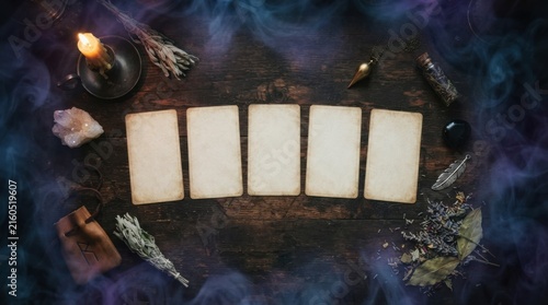 Empty Tarot Cards on Dark Wooden Table Surrounded by Mystic Items