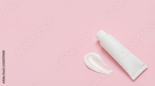 White Cream Tube and Swatch on Pink Background