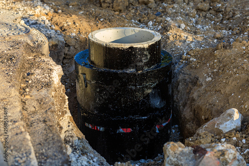Картината върху платно New pipe being installed in a dirt trench for a construction project