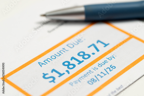 Canvastavla A utility bill displaying the amount due and payment deadline with a pen, illustrating household expenses, budgeting, medical bill payments, personal finance and financial planning