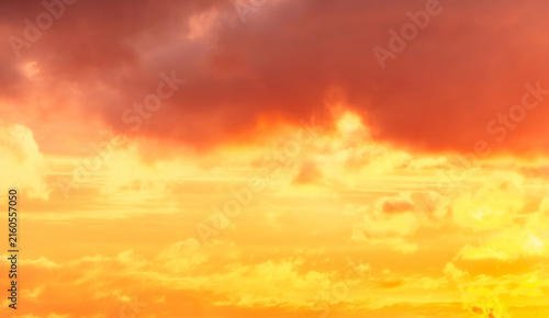 Konstfotografi Fiery orange and red clouds blaze across a dramatic sunset sky.