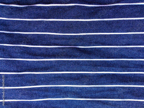 Fotografie Blue jeans denim fabric background with white pinstripe pattern