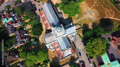 Top-down drone shot of Romsey Abbey's cruciform roof, central tower and surrounding memorial garden.
