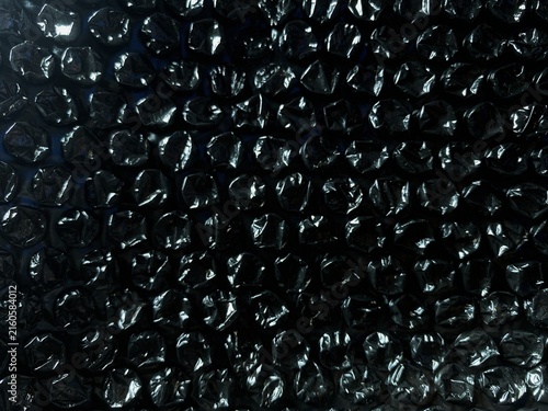 Fotografie Black bubble wrap texture background for packaging and protection concept