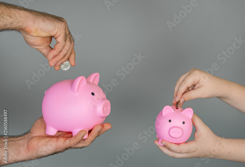 Quadro su tela Child saving with piggy bank