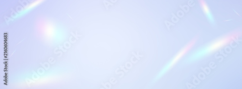 Fantastical rainbow-colored light streaming through a pastel-colored background and the gradient of a prism