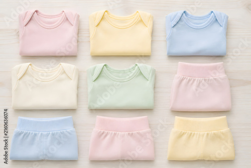 Folded baby clothes flat lay