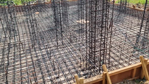 Construction Site View of Iron Mesh and Pillar Reinforcements for Building Foundation Preparation
