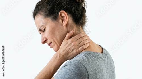 Woman holding her neck in pain against a white background