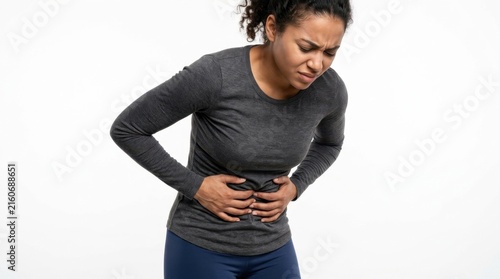 Young woman suffering from abdominal pain against a white background