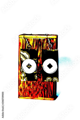 Cuadro en lienzo Handcrafted ethnic dangling earrings featuring traditional batik pattern and coin motif displayed on a rustic wooden stand